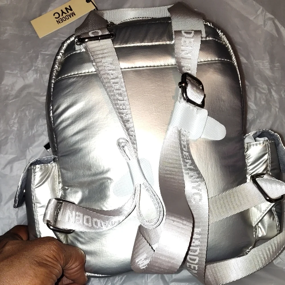 Steve Madden Silver Backpack. Front and side pockets.
